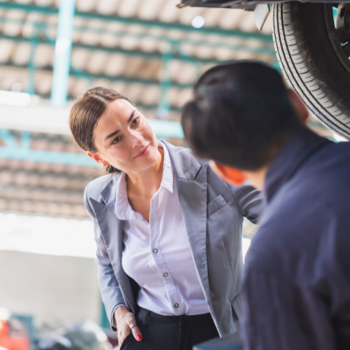woman in service center mentoring new employee
