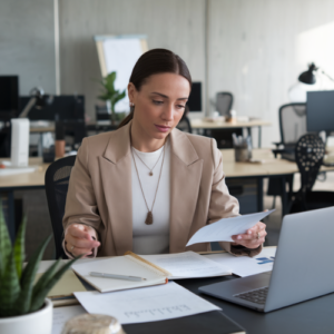 woman reviewing plan at her desk