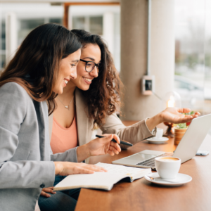 two women talking over coffee