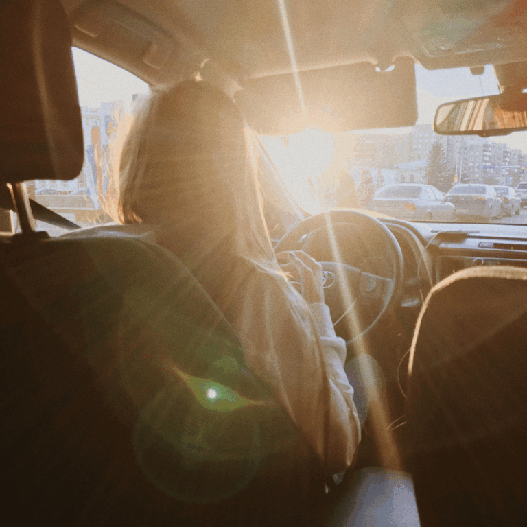 woman in car thinking