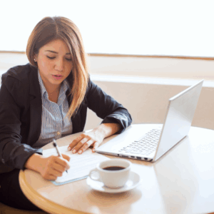 woman writing out her 2025 career goals