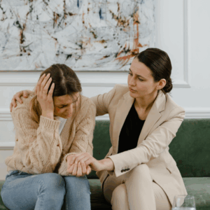 female manager/boss comforting employee